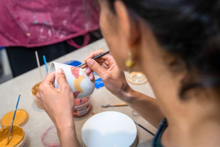 glazing pottery with paintbrush